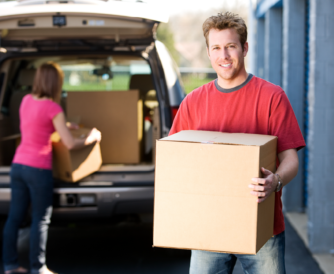 Man with box-01 Self storage in Alvin, TX